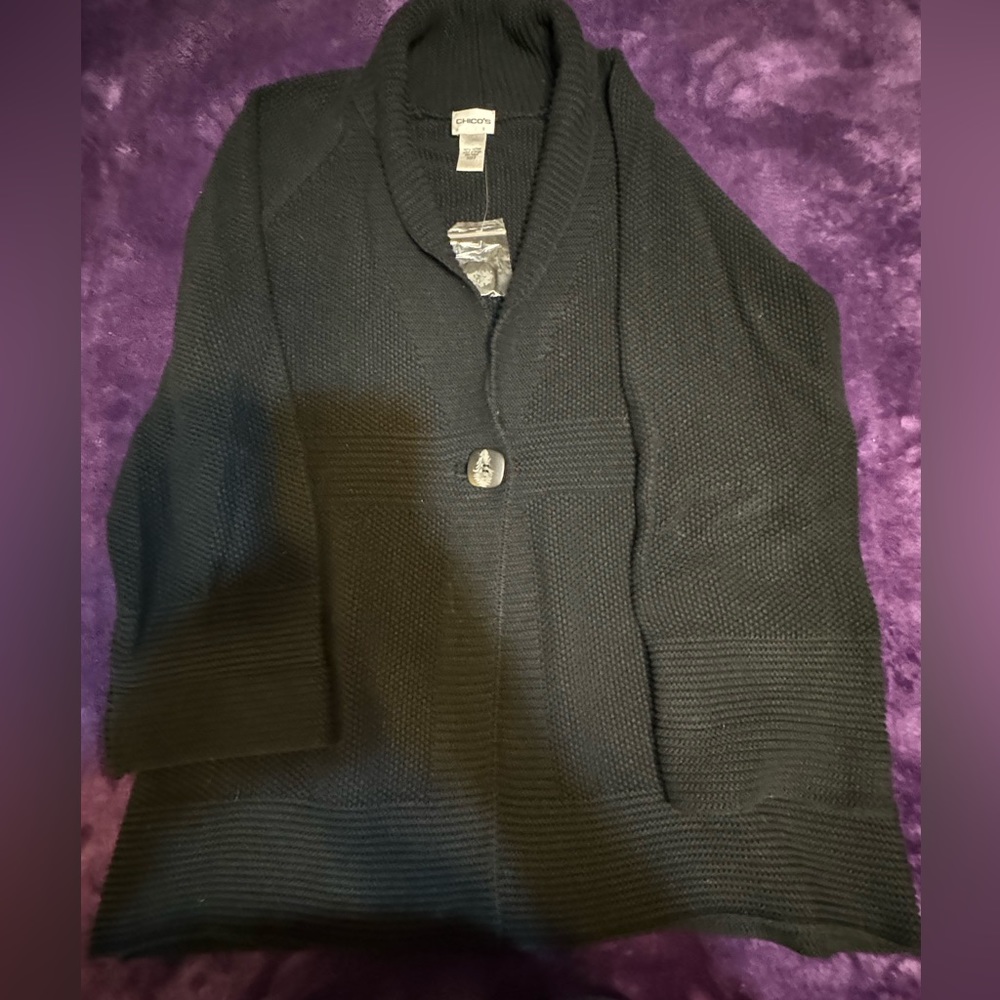 A dark blue heavy sweater.